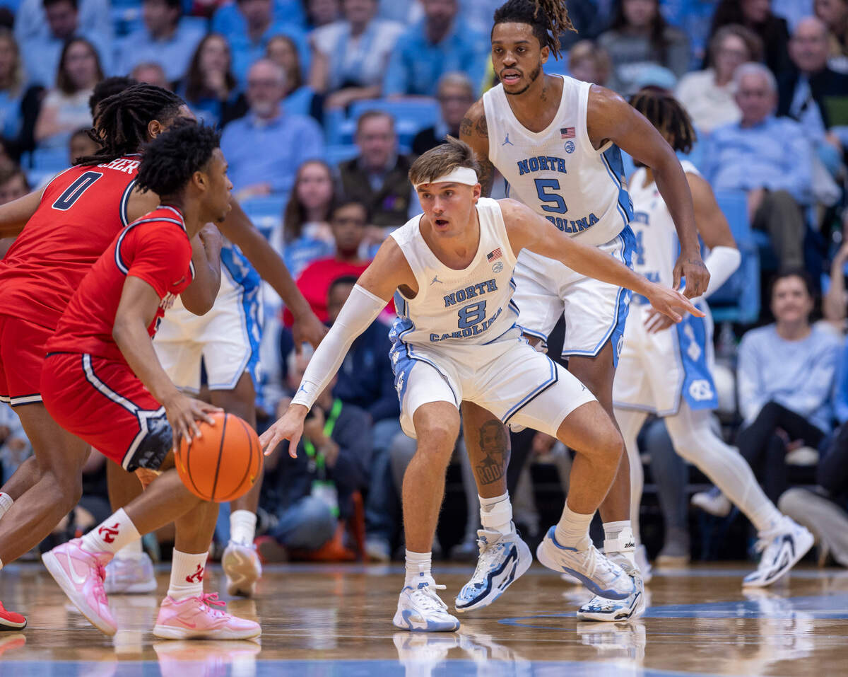 North Carolina’s Paxson Wojcik (8) defends Radford’s Kenyon Giles (3) in the second half on Monday, November 6, 2023 at the Dean Smith Center in Chapel Hill, N.C.