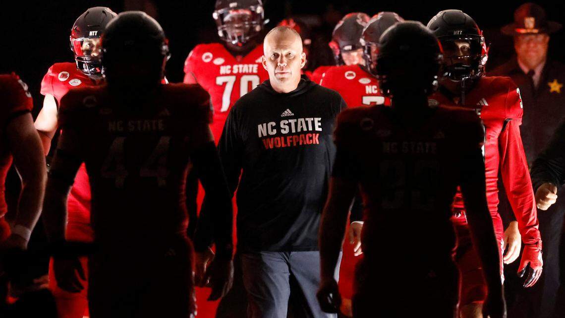 N.C. State head coach Dave Doeren leads his team down the tunnel before taking the field before the Wolfpack’s game against Miami at Carter-Finley Stadium in Raleigh, N.C., Saturday, Nov. 4, 2023.