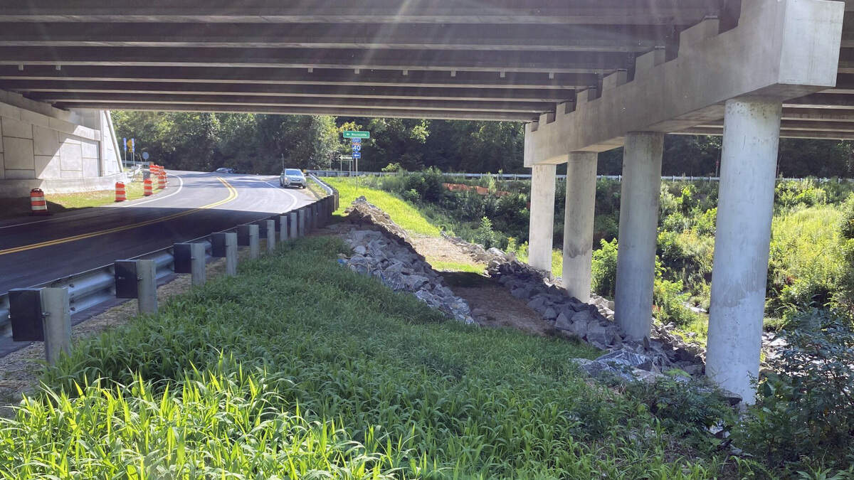 The North Carolina Department of Transportation incorporated a wildlife “bench” during the 2022 reconstruction of the bridge at Harmon Den along Interstate 40. Rather than the entire steep bank being covered in granite riprap from top to bottom, a level path built into the slope allows for wildlife to cross safely under the highway.