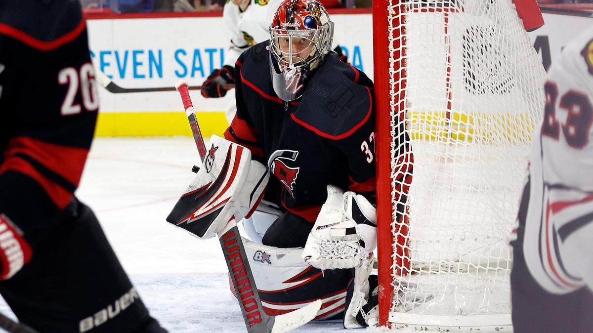 Carolina Hurricanes goaltender Antti Raanta (32) watches the puck during the third period of an NHL hockey game against the Chicago Blackhawks in Raleigh, N.C., Tuesday, Dec. 27, 2022. (AP Photo/Karl B DeBlaker)
