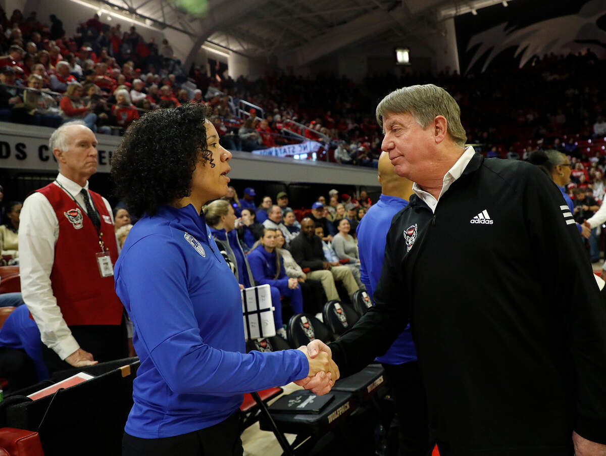 Duke head coach Kara Lawson speaks with N.C. State head coach Wes Moore prior to the Blue Devils’ game on Sunday, Jan. 21, 2024, at Reynolds Coliseum in Raleigh, N.C.