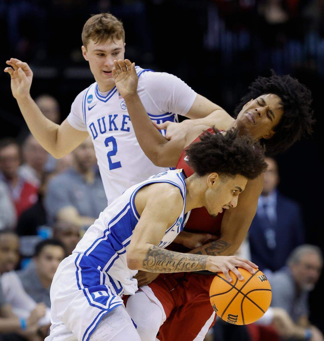 Duke’s Tyrese Proctor toys to drive by an Alabama defender Aden Holloway in first Elite 8 action.