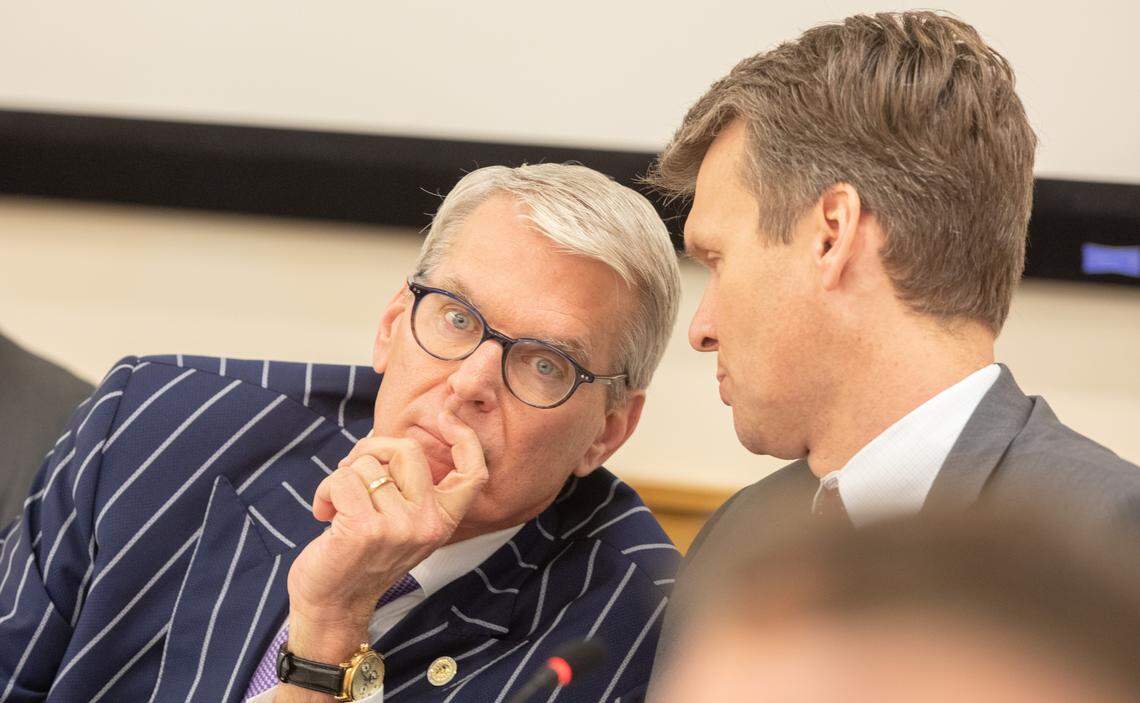 UNC System Committee on Student Governance chair David Powers, left, confers with UNC System general counsel Tom Shanahan on Feb. 5, 2020.