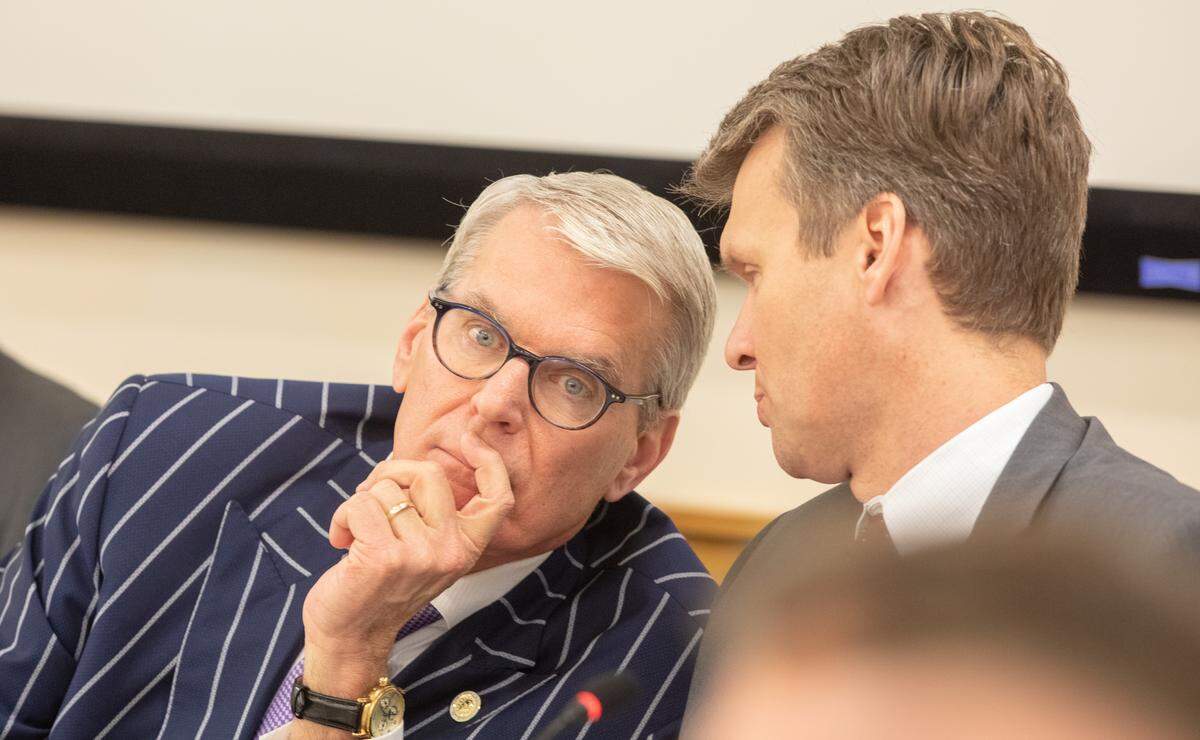 UNC System Committee on Student Governance chair David Powers, left, confers with UNC System general counsel Tom Shanahan on Feb. 5, 2020.