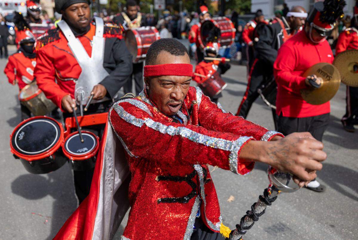The Helping Hand Mission Band performs on Fayetteville Street during the 80th annual Raleigh Christmas Parade on Saturday, November 23, 2024 in Raleigh, N.C.