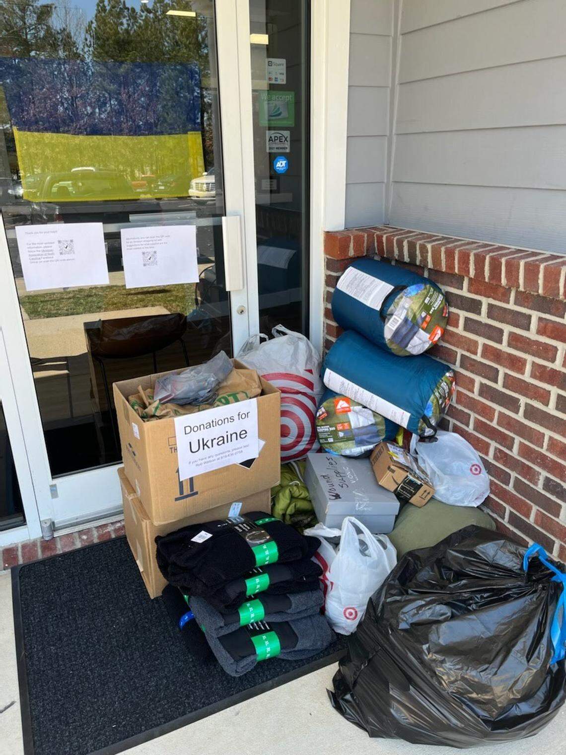 Donations to be sent to Ukraine sit in a pile outside of Bass & Watson Family Dental’s office in Apex. Collection is ongoing, said Lyana Klymyuk Watson, a Ukrainian living in Apex.