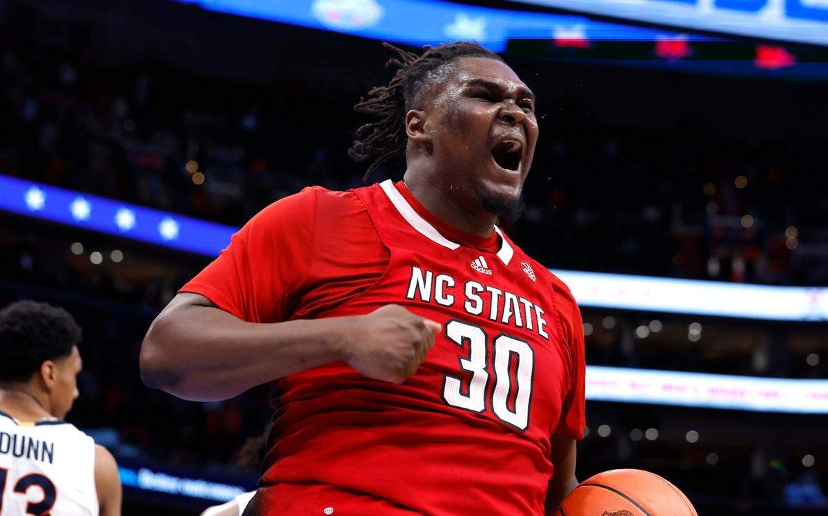 N.C. State’s DJ Burns Jr. (30) celebrates in overtime during N.C. State’s 72-65 overtime victory over Virginia in the semifinals of the 2024 ACC Men’s Basketball Tournament at Capital One Arena in Washington, D.C., Friday, March 15, 2024.