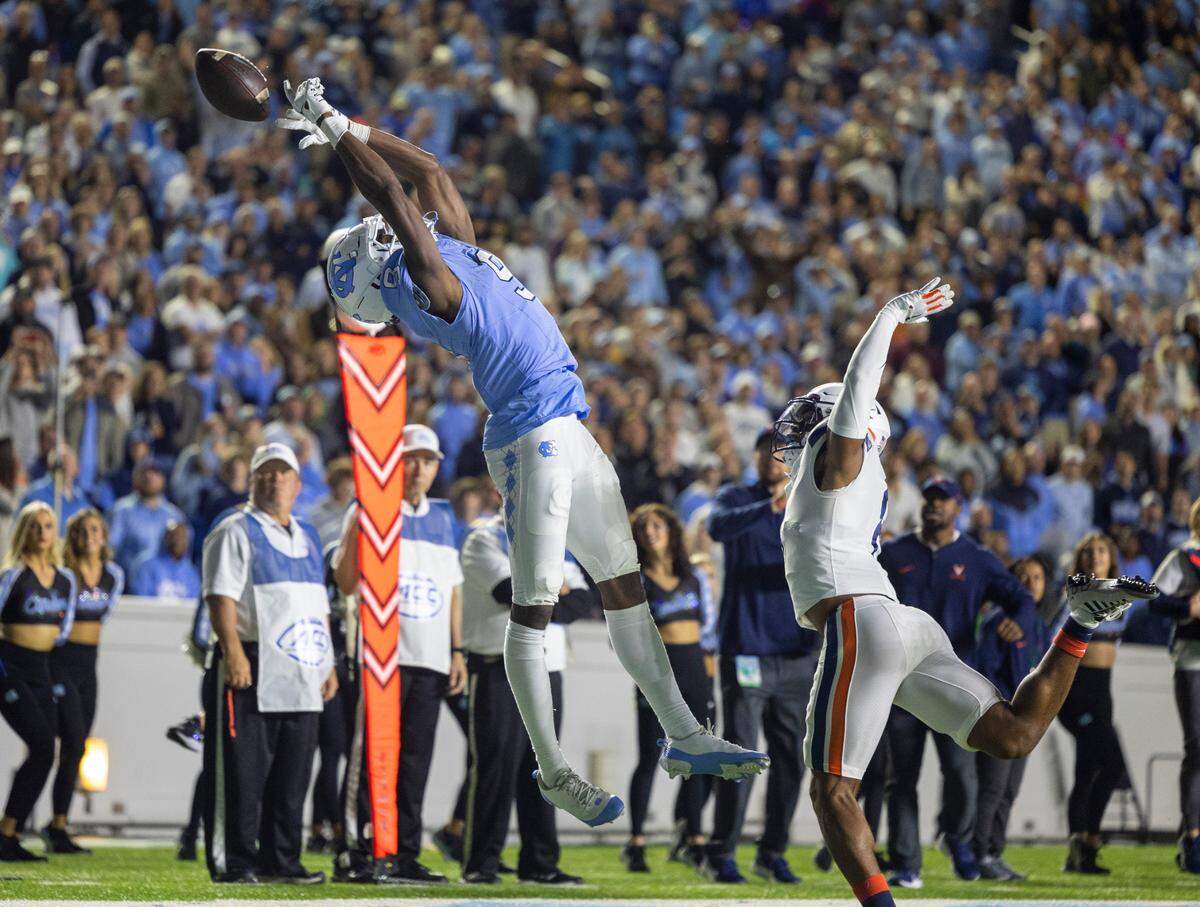 North Carolina wide receiver Devontez Walker (9) can’t pull in a pass from quarterback Drake Maye, turning the ball over to Virginia on fourth down on Saturday, October 21, 2023 at Kenan Stadium in Chapel Hill, N.C.