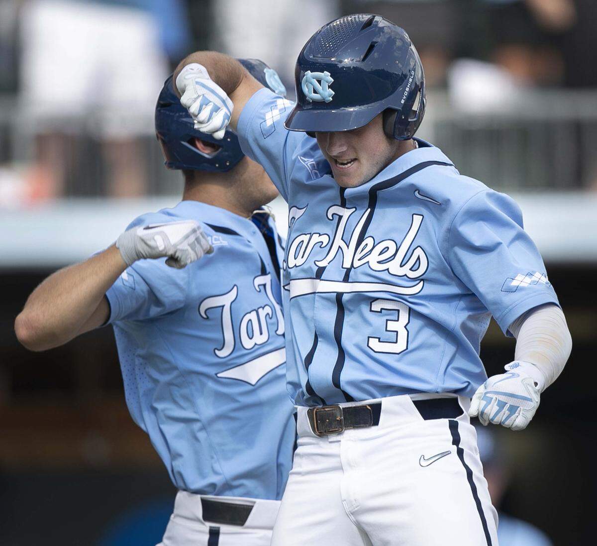 North Carolina’s Dylan Harris (3) celebrates with Brandon Martorano (4) after connecting for a home run in the first inning against Liberty to give the Tar Heels’ a 1-0 lead during the NCAA regional on Saturday, June 1, 2019 at Boshamer Stadium in Chapel Hill, N.C.