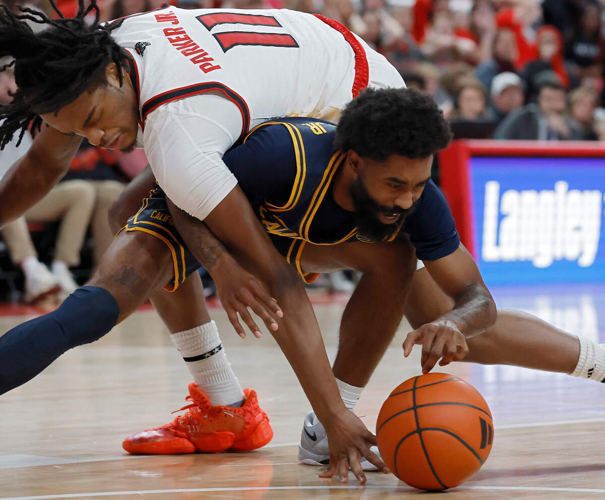 N.C. State’s Dennis Parker Jr. and California’s Jovan Blacksher Jr. scramble for a loose ball during the second half of the Wolfpack’s 65-62 loss on Saturday, Jan. 18, 2025, at Lenovo Center in Raleigh, N.C.
