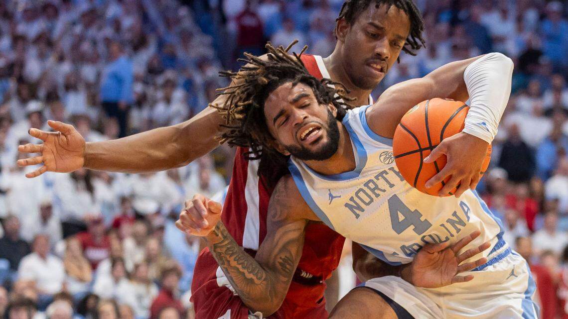 Alabama forward Derrion Reid (35) slows North Carolina guard R.J. Davis (4) with defense in the second half on Wednesday, December 4, 2024 at the Smith Center in Chapel Hill, N.C.