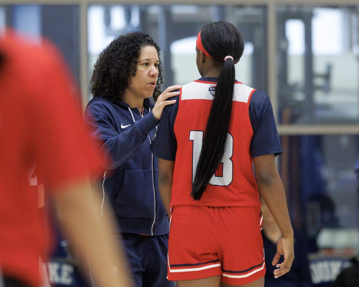Head coach Kara Lawson talks with Jackie Young during USA Basketball Women’s National Team training camp on Friday, Dec. 12, 2025, in Durham, N.C.