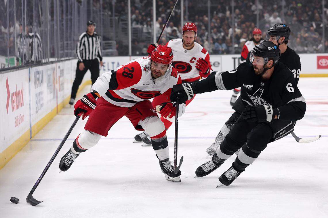 William Carrier (28) of the Carolina Hurricanes controls the puck against Joel Edmundson (6) of the Los Angeles Kings during the first period at Crypto.com Arena on Oct. 18, 2025 in Los Angeles, California. Carrier returned to the lineup Saturday after an extended stint on the IR.