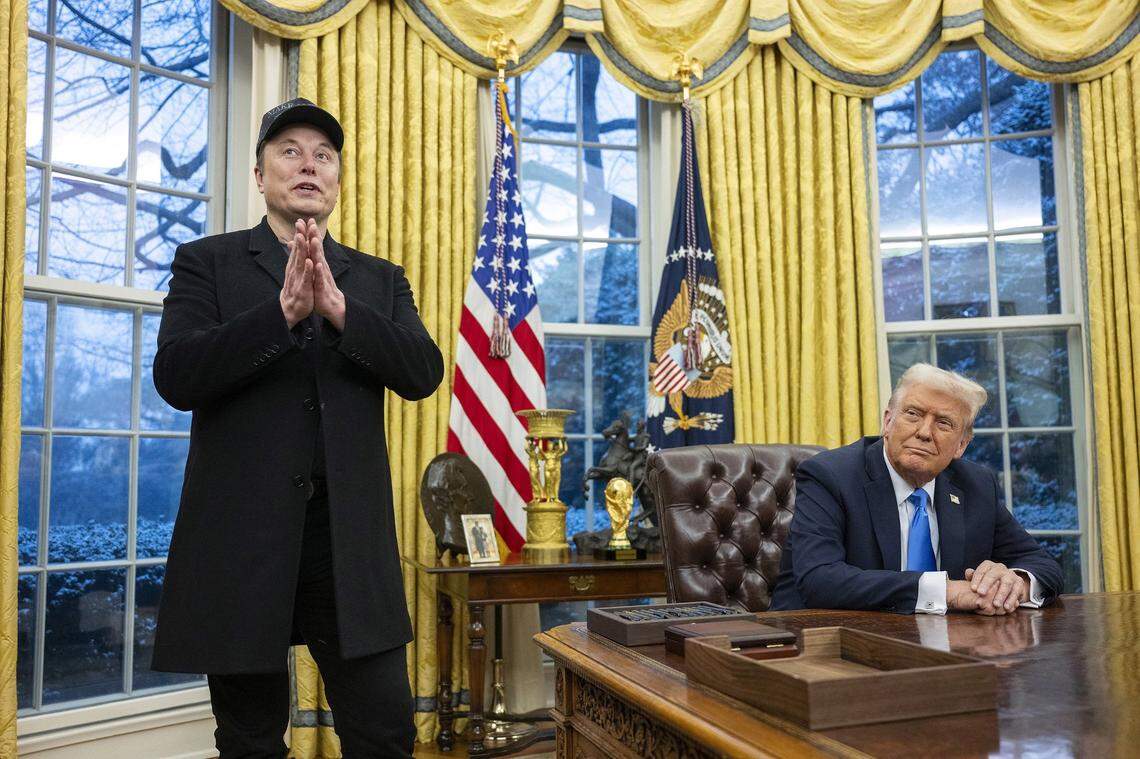 Elon Musk speaks as President Donald Trump looks on in the Oval Office of the White House in Washington, D.C., on Feb. 11, 2025. 