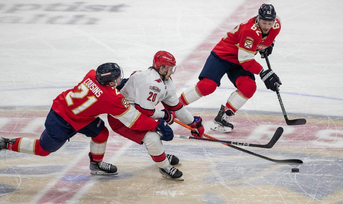 The Florida Panthers Nick Cousins (21) and Brandon Montour (62) work to slow the Carolina Hurricanes Sebastian Aho (20) in the first period of Game 3 of the Eastern Conference Finals on Monday, May 22, 2023 at FLA Live Arena in Sunrise, Fla.