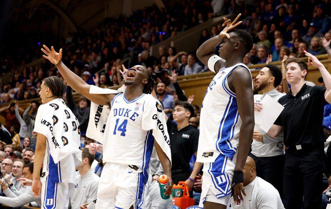 The bench, including Duke’s Sion James (14) and Khaman Maluach (9), celebrate after Caleb Foster made a three-pointer during the second half of Duke’s 89-54 victory over Miami at Cameron Indoor Stadium in Durham, N.C., Tuesday, Jan. 14, 2025.