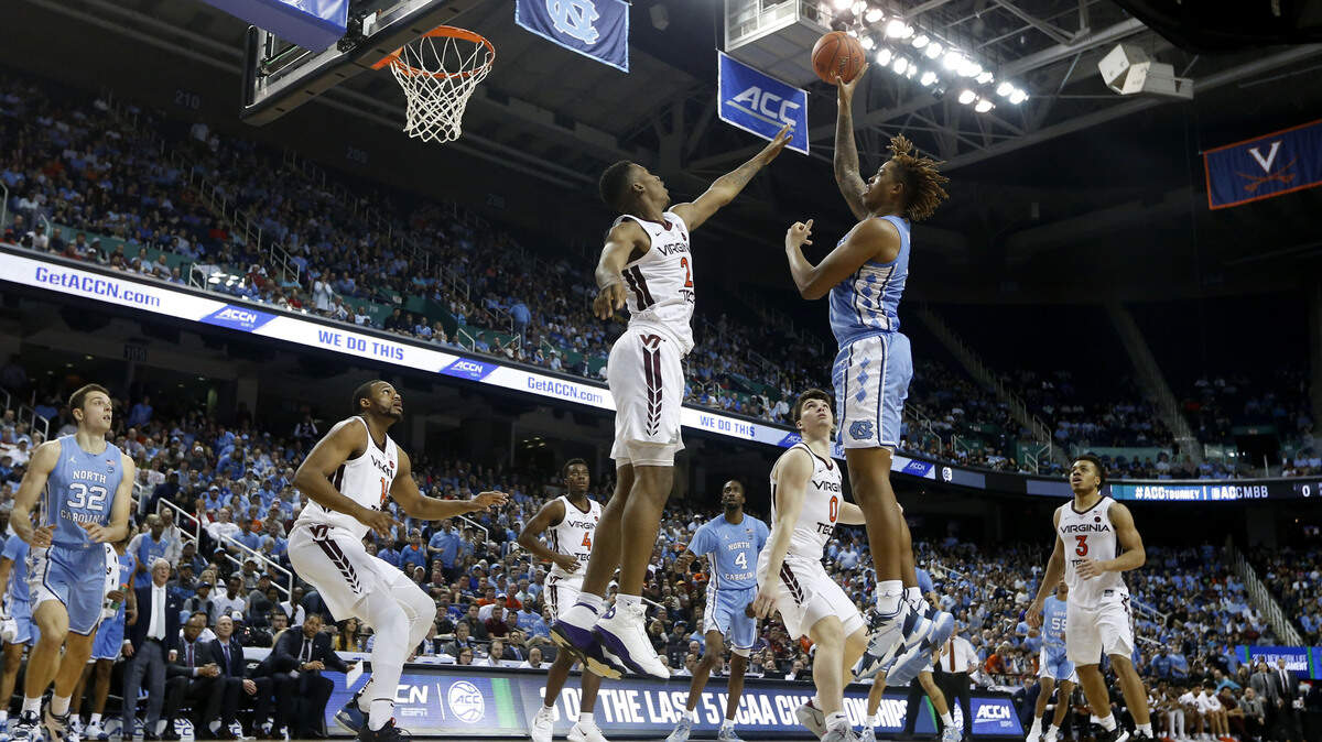 UNC’s Armando Bacot (5) shoots as Virginia Tech’s Landers Nolley II (2) defends during the North Carolina Tar Heels’ 78-56 victory over the Virginia Tech Hokies in the first round of the ACC Tournament at Greensboro Coliseum in Greensboro, N.C., Tuesday, March 10, 2020.