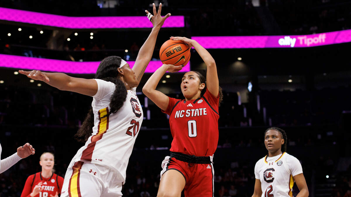 N.C. State’s Devyn Quigley shoots over South Carolina’s Sania Feagin during the first half of the Wolfpack’s game on Sunday, Nov. 10, 2024, at Spectrum Center in Charlotte, N.C.