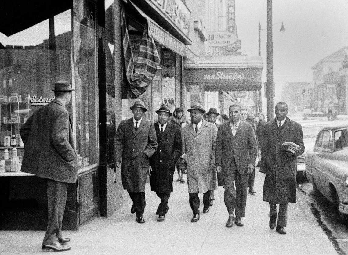 Dr. Martin Luther King, Jr. (facing camera, second from left) walks along West Main Street towards Woolworth in Durham on February 2, 1960 following sit-ins. King was joined by other local and national civil rights leaders.