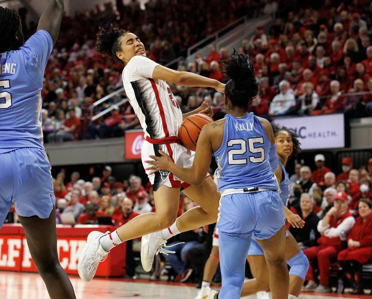 N.C. State’s Madison Hayes drives against the defense of North Carolina’s Deja Kelly during the second half of the Wolfpack’s 63-59 win on Thursday, Feb. 1, 2024, at Reynolds Coliseum in Raleigh, N.C.