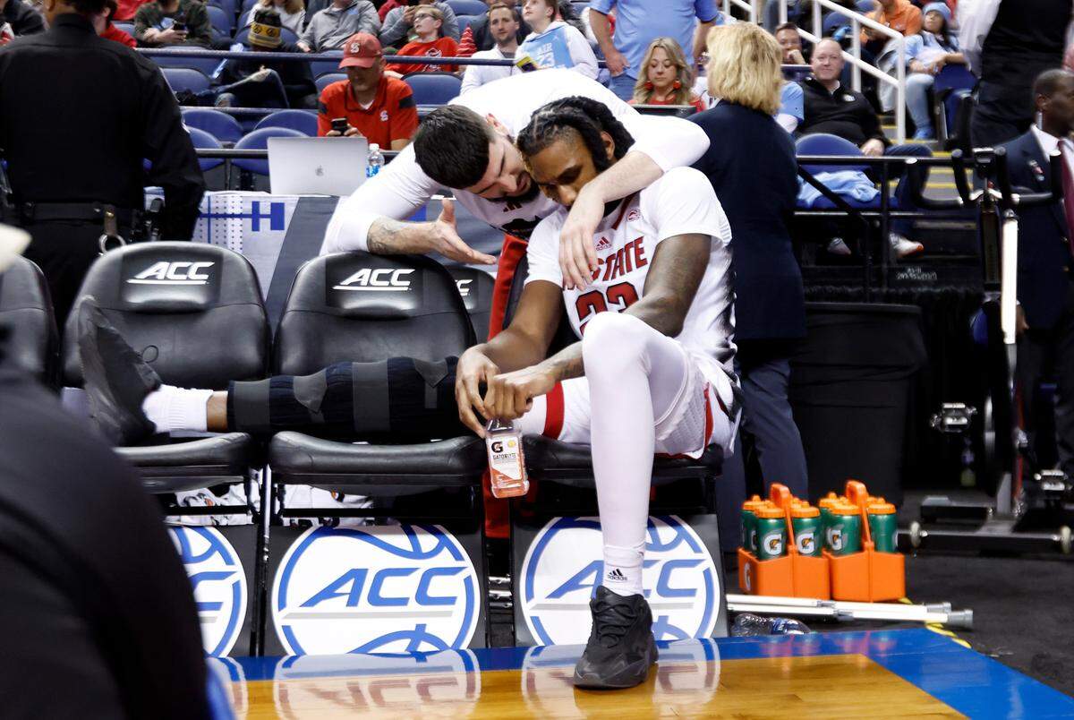 N.C. State’s Dusan Mahorcic talks with Greg Gantt after Gantt returned to the bench after he was injured during the Wolfpack’s 97-77 victory over Virginia Tech in the second round of the ACC Men’s Basketball Tournament in Greensboro, N.C., Wednesday, March 8, 2023.
