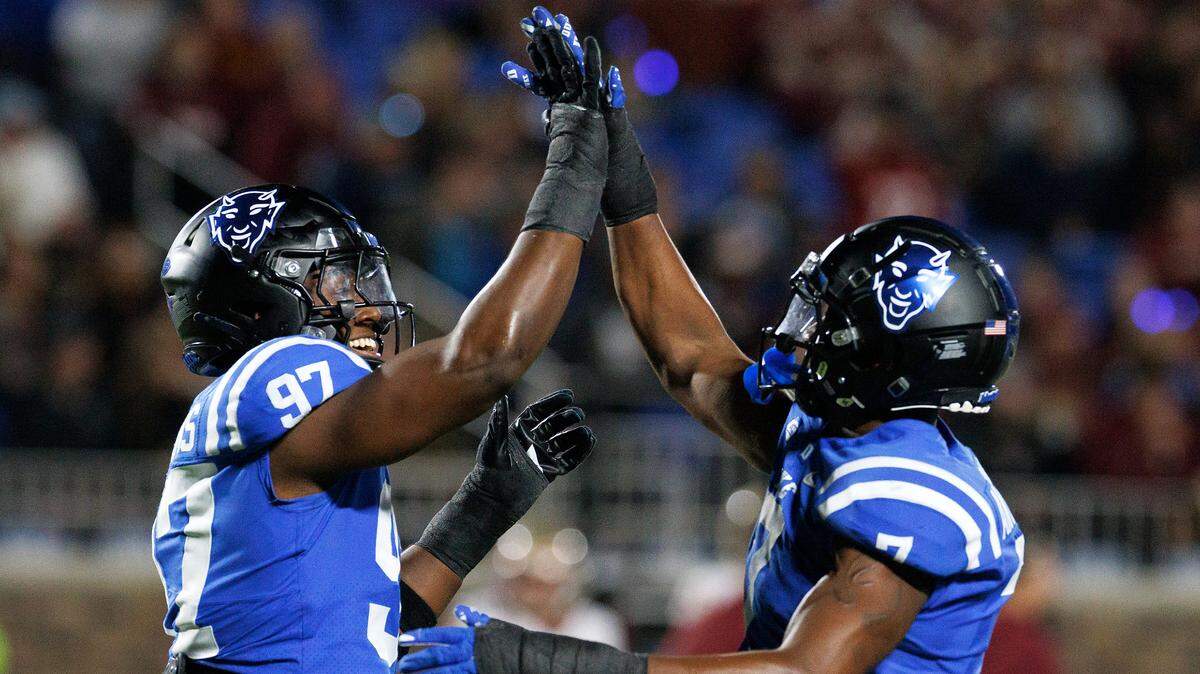 Duke’s Wesley Williams and Vincent Anthony Jr. celebrate following a defensive stop during the first half of the Blue Devils’ game against Florida State on Friday, Oct. 18, 2024, at Wallace Wade Stadium in Durham, N.C.