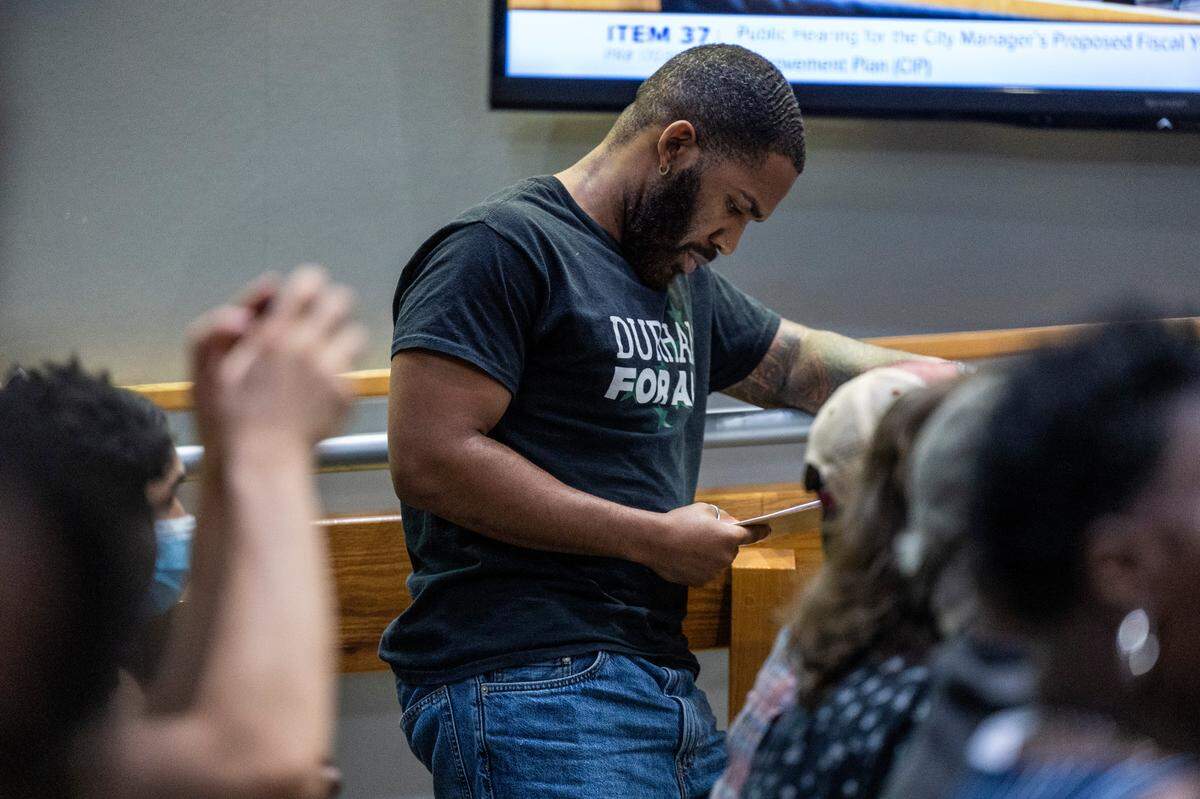 Cedrick Craig of Durham For All looks over his notes before speaking during a Durham budget meeting on Monday, June 3, 2024.