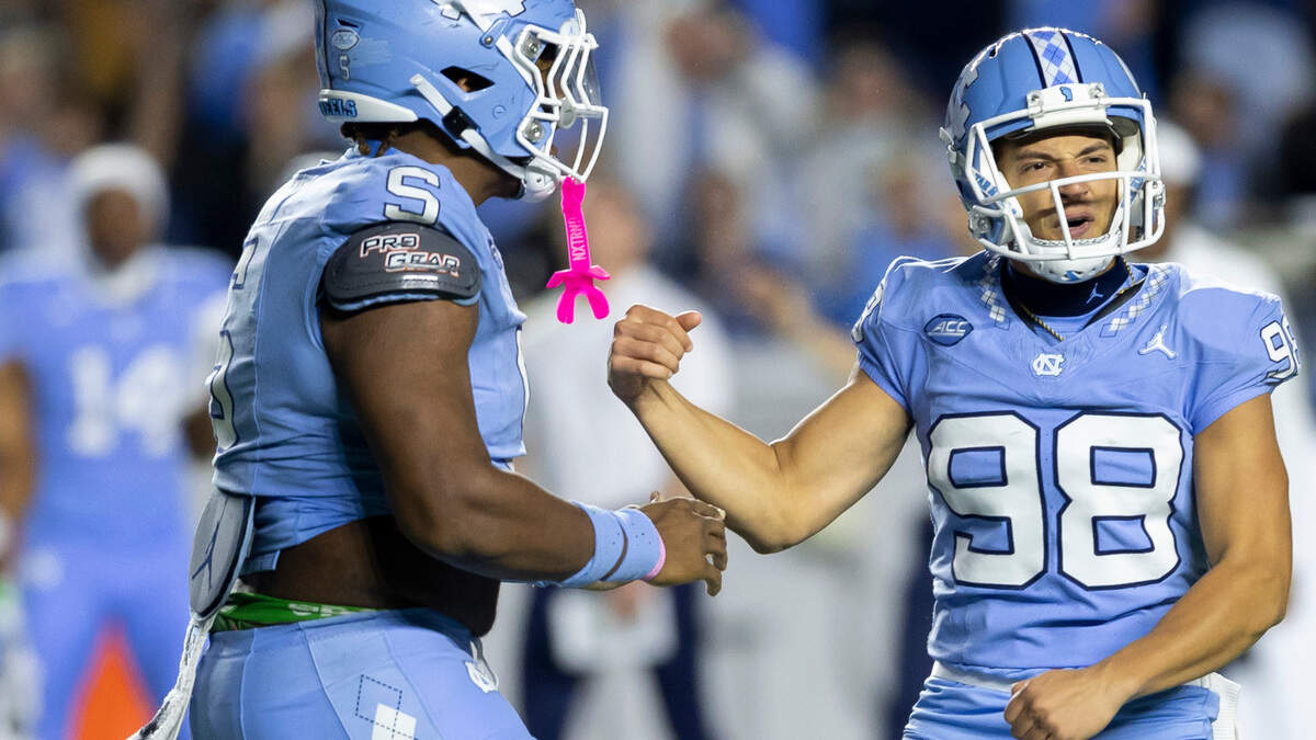 North Carolina kicker Noah Burnette (98) reacts after booting a 43-yard field goal to tie Duke 36-36 at the end of regulation, forcing overtime on Saturday, Nov. 11, 2023 at Kenan Stadium in Chapel Hill, N.C.