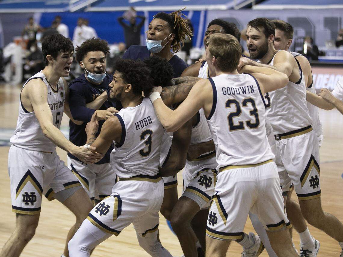 Notre Dame celebrates their 80-77 victory over Wake Forest, surrounding Trey Wertz (2) after he hit a three point basket at the buzzer on Tuesday, March 9, 2021 during the ACC Tournament at the Greensboro Coliseum in Greensboro, N.C.