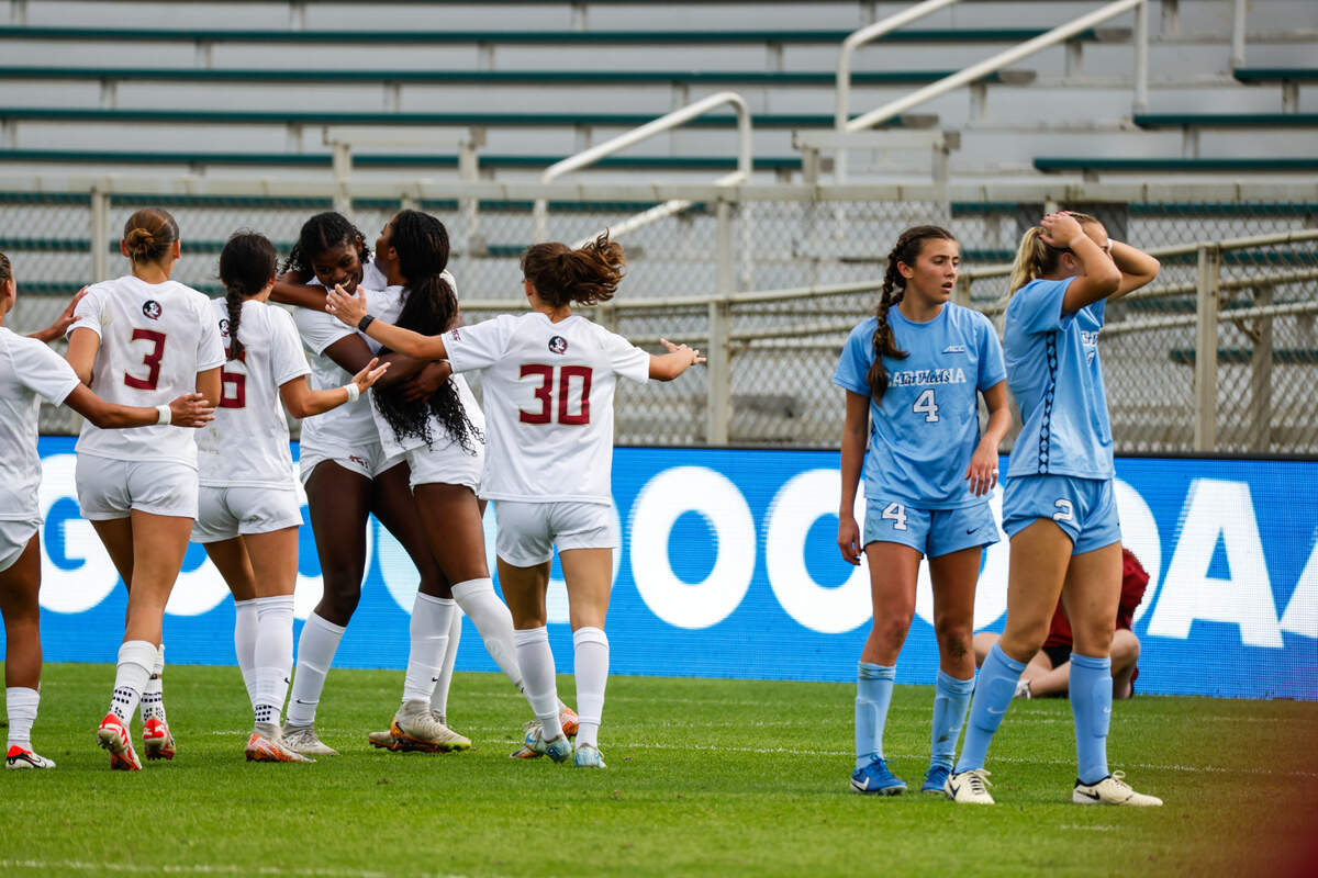 UNC players Aven Alvarez (4) and Evelyn Shores (2) react as Florida State players celebrate a goal during the 2024 Ally ACC Women’s Soccer Championship in Cary, N.C. on Sunday Nov. 10.