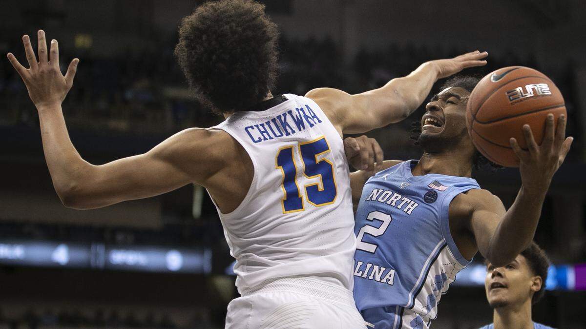 North Carolina’s Coby White (2) drives to the basket against Pitt’s Kene Chukwuka (15) during the second half on Saturday, January 5, 2019 at Peterson Events Center in Pittsburgh, Pa. White lead all scores with 22 points in their 85-60 victory.