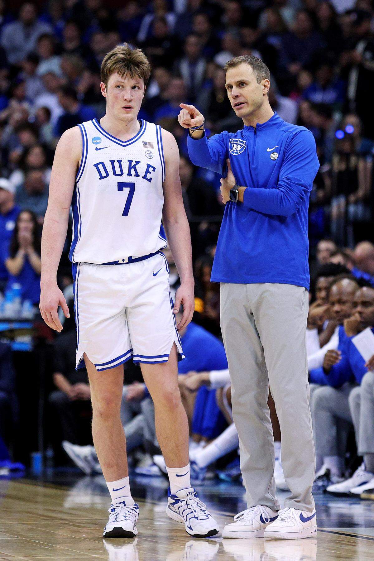 Mar 29, 2025; Newark, NJ, USA; Duke Blue Devils head coach Jon Scheyer talks to Duke Blue Devils guard Kon Knueppel (7) during the second half against the Alabama Crimson Tide in the East Regional final of the 2025 NCAA tournament at Prudential Center. Mandatory Credit: Vincent Carchietta-Imagn Images