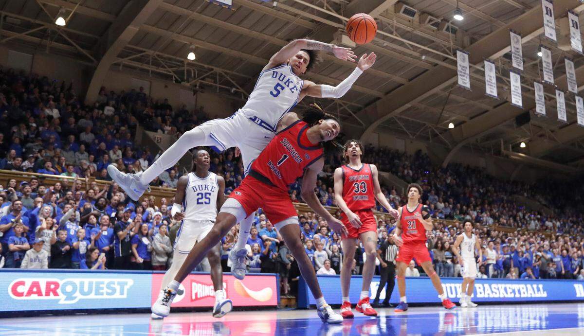 Southern Indiana’s Javius Moore (1) fouls Duke’s Tyrese Proctor (5) after Proctor dunked the ball during Duke’s 80-62 victory over Southern Indiana at Cameron Indoor Stadium in Durham, N.C., Friday, Nov. 24, 2023. Moore and Proctor were both called for a technical.