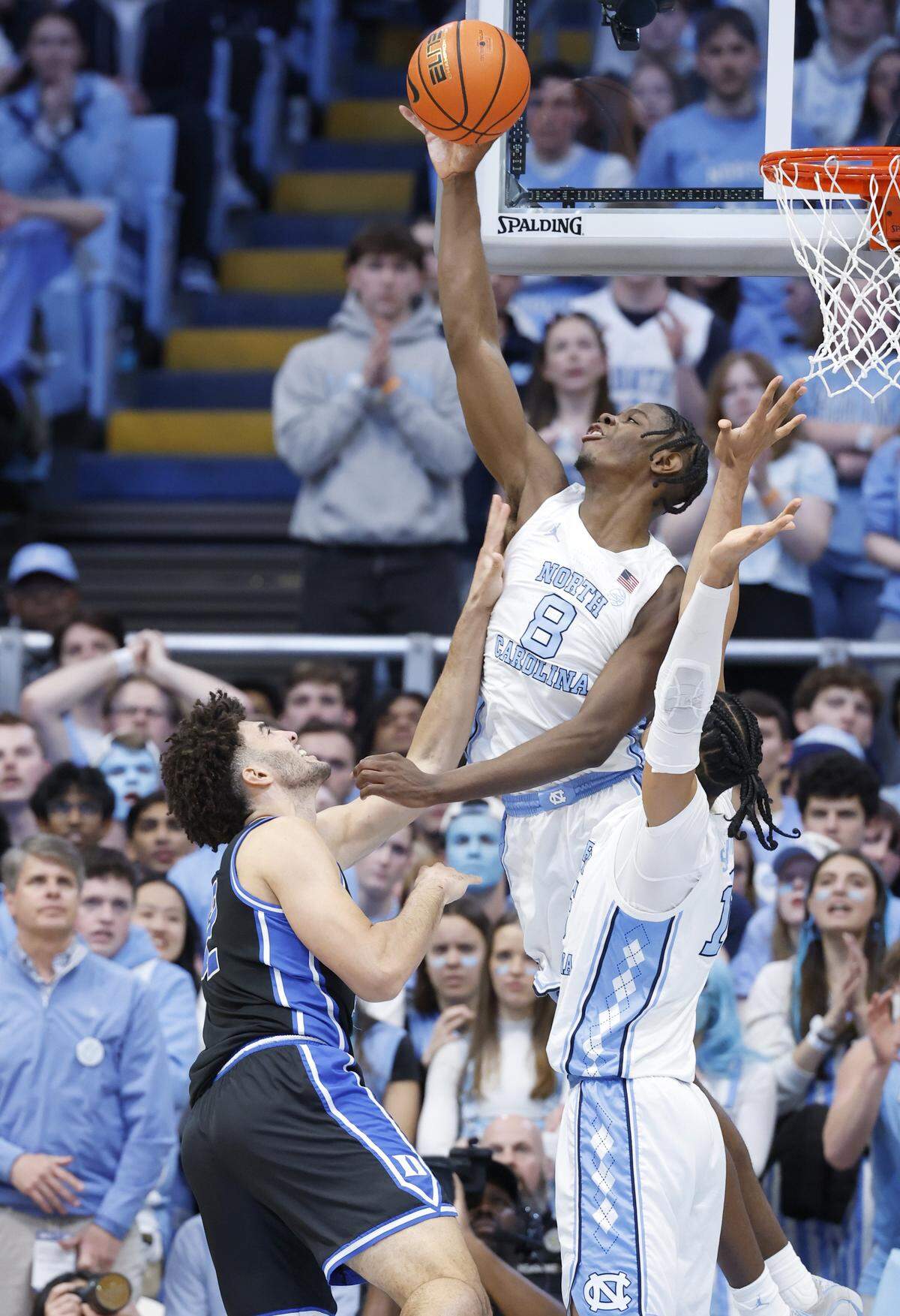 North Carolina's Caleb Wilson (8) blocks the shot by Duke’s Cameron Boozer (12) during the first half of Duke’s game against UNC at the Dean E. Smith Center in Chapel Hill, N.C., Saturday, Feb. 7, 2026.