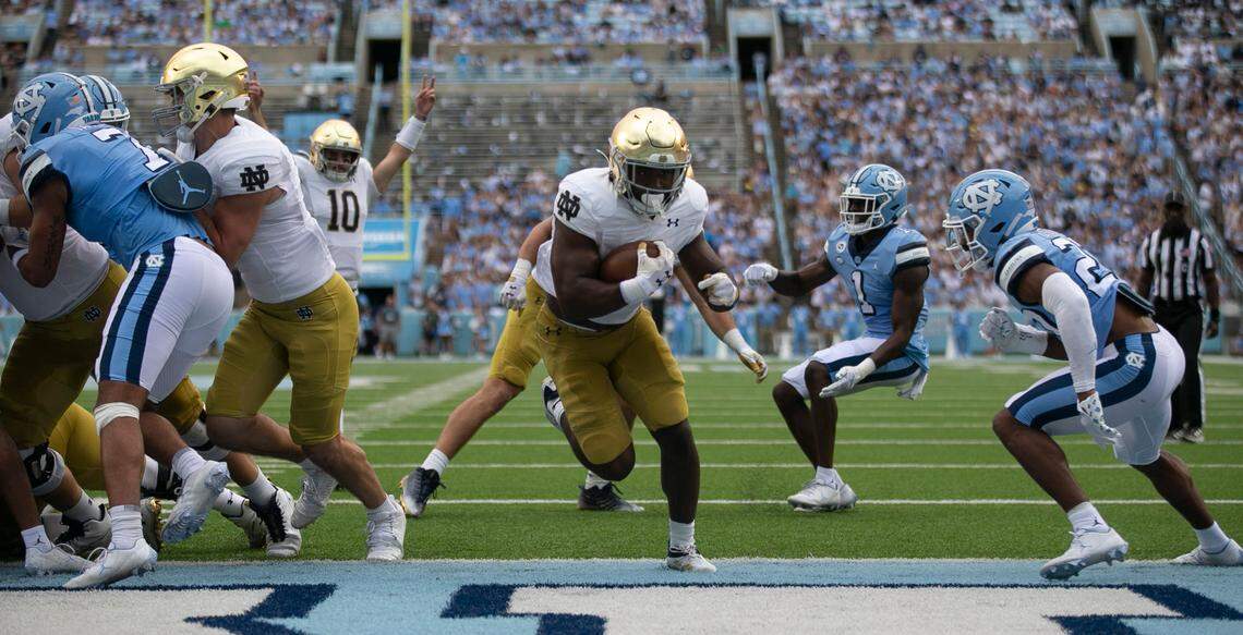 Notre Dame’s Audric Estime (7) scores on a one-yard run to give the Irish a 21-14 lead over North Carolina in the second quarter on Saturday, September 24, 2022 at Kenan Stadium in Chapel Hill, N.C.
