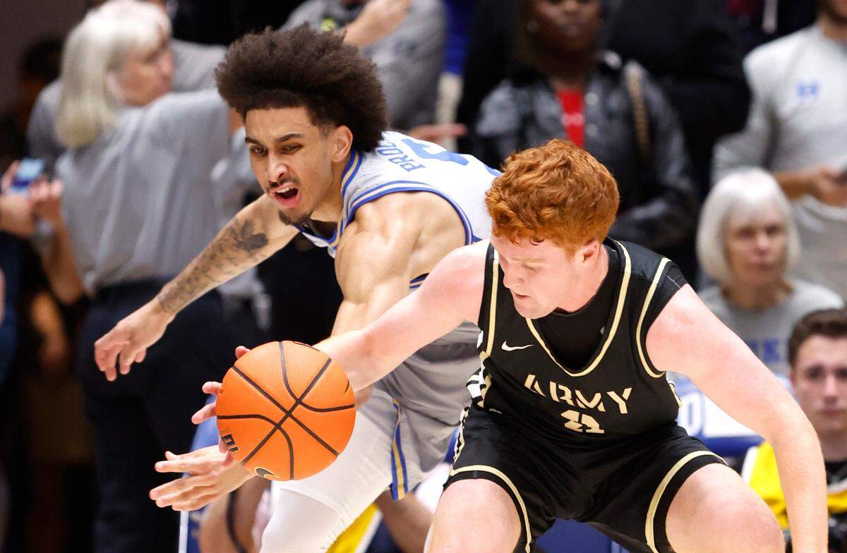 Duke’s Tyrese Proctor (5) knocks the ball from Army’s Ryan Curry (2) during the first half of Duke’s game against Army at Cameron Indoor Stadium in Durham, N.C., Friday, Nov. 8, 2024.