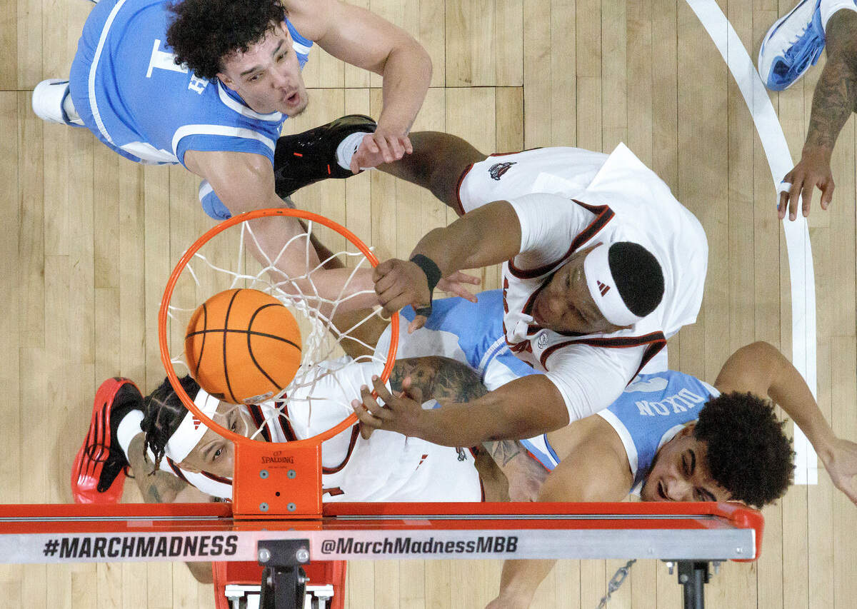 N.C. State’s Ven-Allen Lubin slams in two during the first half of the Wolfpack’s 82-58 win over North Carolina on Tuesday, Feb. 17, 2026, at Lenovo Center in Raleigh, N.C.