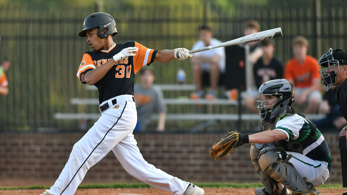 Fuquay-Varina’s TJ hardy (30) follows through on his swing after hitting the ball. The Fuquay-Varina Bengals and the Leesville Road Pride met in the first round of the NCHSAA 4A baseball playoffs in Raleigh, N.C. on May 7, 2019.