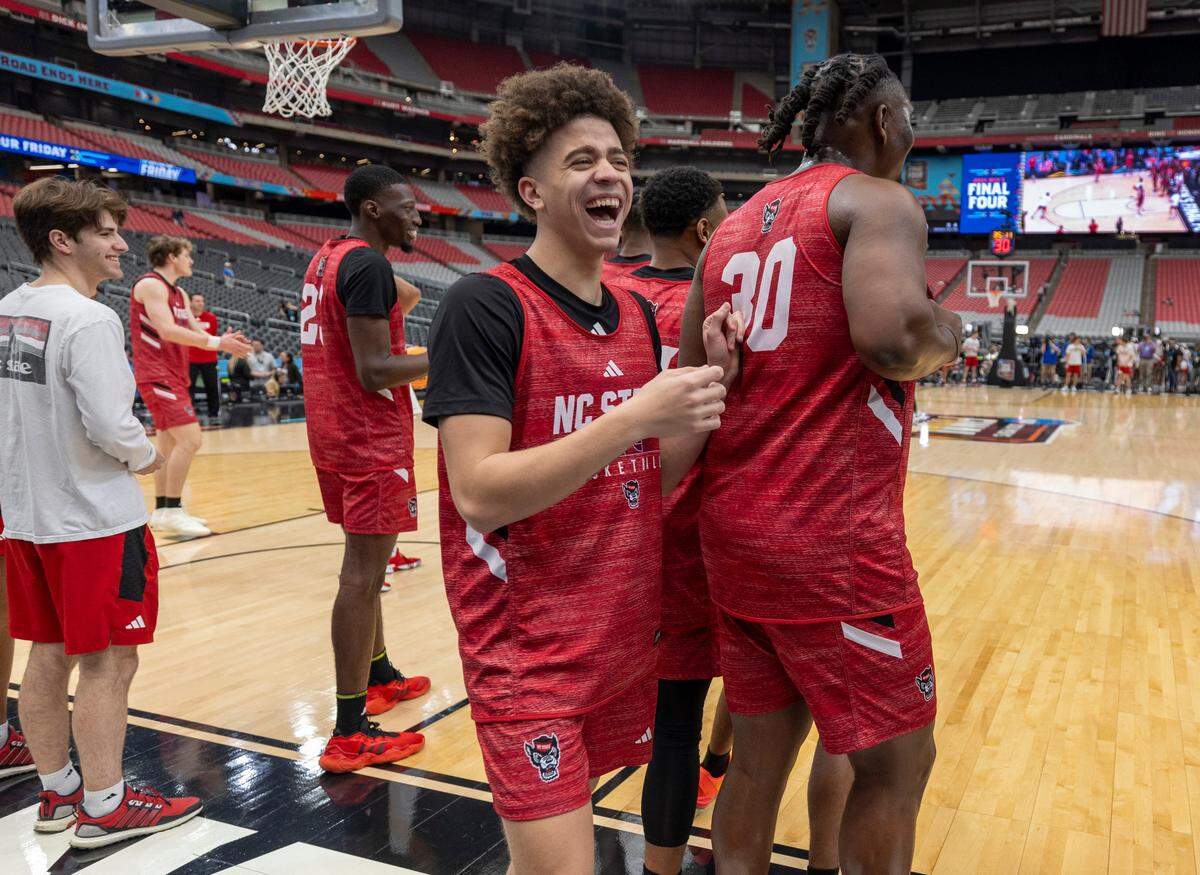 N.C. State’s Jordan Snell (22) laughs with D.J. Burns Jr. (30) during the Wolfpack’s practice on Friday, April 5, 2024, as they prepare for their NCAA National Semi-Final game against Purdue at State Farm Stadium in Glendale, AZ.