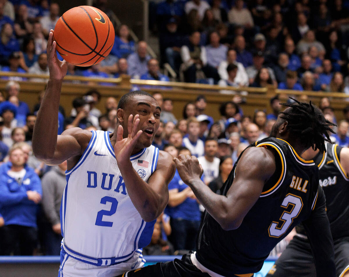 Duke’s Jaylen Blakes draws a blocking foul from La Salle’s Anwar Gill during the second half of the Blue Devils’ 95-66 win on Tuesday, Nov. 21, 2023, at Cameron Indoor Stadium in Durham, N.C.
