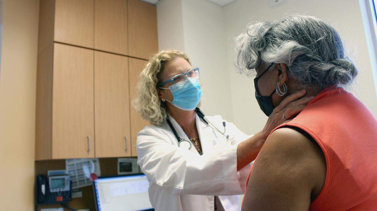 Medical oncologist and UNC-CH cancer researcher Dr. Lisa A. Carey examines a breast cancer patient at the North Carolina Cancer Hospital.