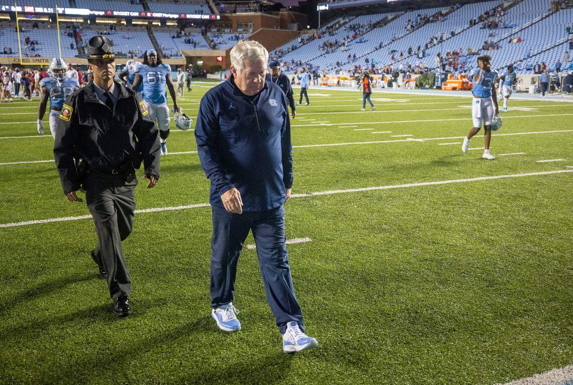 North Carolina coach Mack Brown leave the field following the Tar Heels’ 35-25 loss to Florida State on Saturday, October 9, 2021at Kenan Stadium in Chapel Hill, N.C.