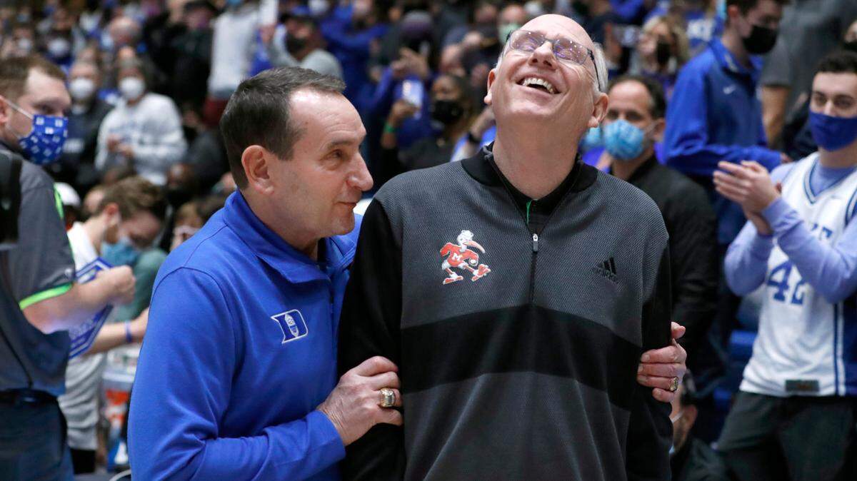 Duke head coach Mike Krzyzewski greets Miami head coach Jim Larrañaga before Duke’s game against Miami at Cameron Indoor Stadium in Durham, N.C., Saturday, January 8, 2022.