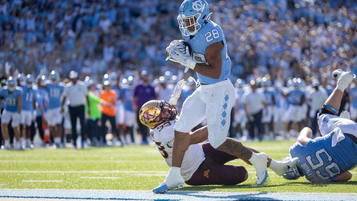 North Carolina running back Omarion Hampton (28) scores a touchdown on a 1-yard run in the second quarter to give the Tar Heels’ a 14-0 lead over Minnesota on Saturday, September 16, 2023 at Kenan Stadium in Chapel Hill N.C.