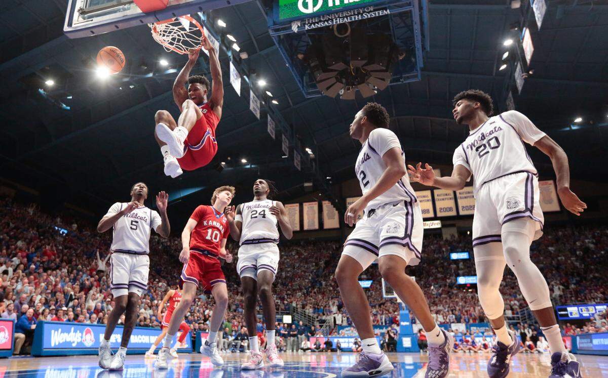 Kansas junior forward KJ Adams Jr. (24) dunks over Kansas State in the Sunflower Showdown game against Kansas State inside Allen Fieldhouse Tuesday, March 5, 2024.