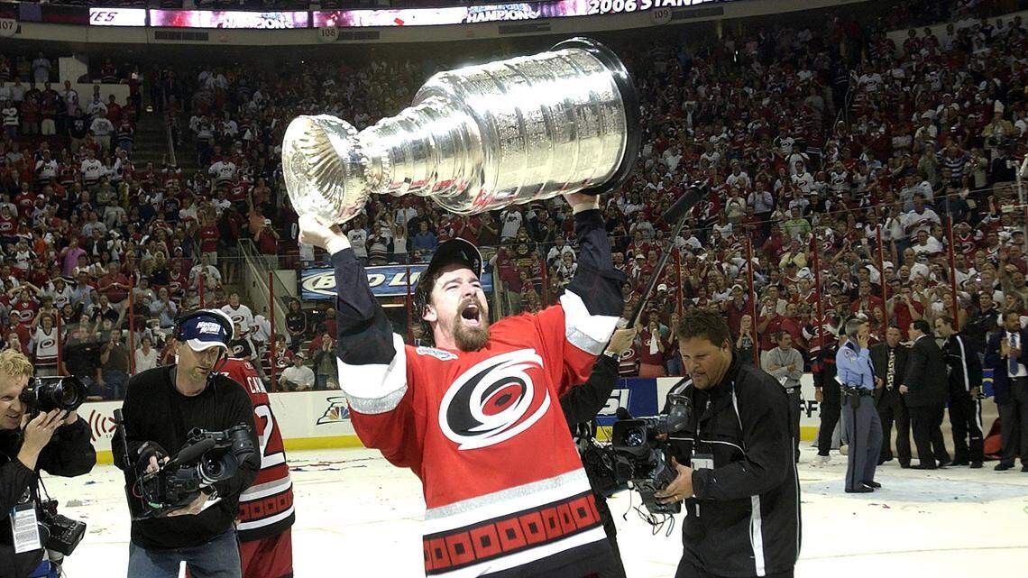 Justin Williams hoists the Stanley Cup at the RBC Center on Monday, June 19, 2006.