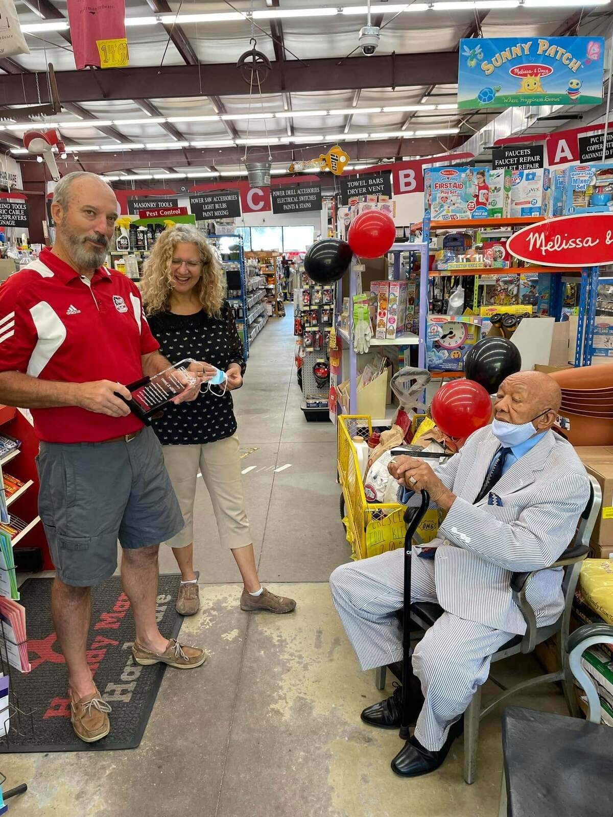 Greg and Deana Lusk at the retirement celebration for Willie Jones at Handyman Hardware in 2021.