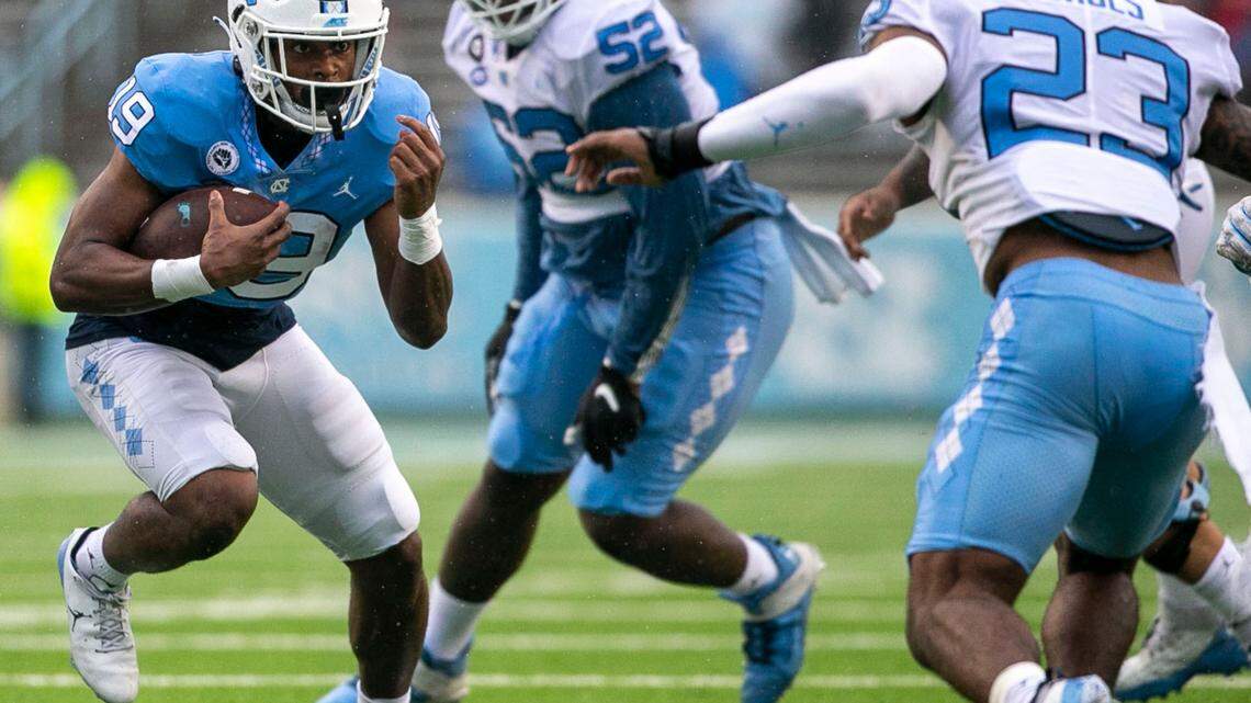 North Carolina running back Ty Chandler (19) carries the ball during the Tar Heels’ spring football game on April 24, 2021 in Chapel Hill.
