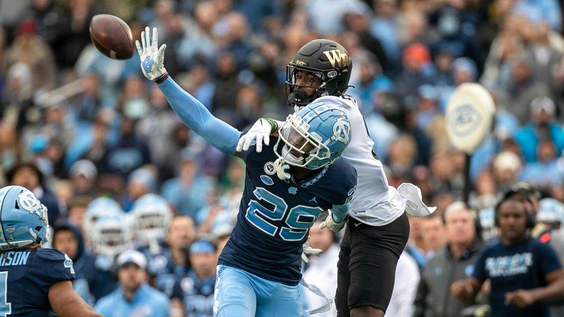 North Carolina’s Storm Duck (29) breaks up a pass intended for Wake Forest’s A.T. Perry (9) on fourth down, turning the ball over to North Carolina and securing their victory on Saturday, November 6, 2021 at Kenan Stadium in Chapel Hill, N.C.