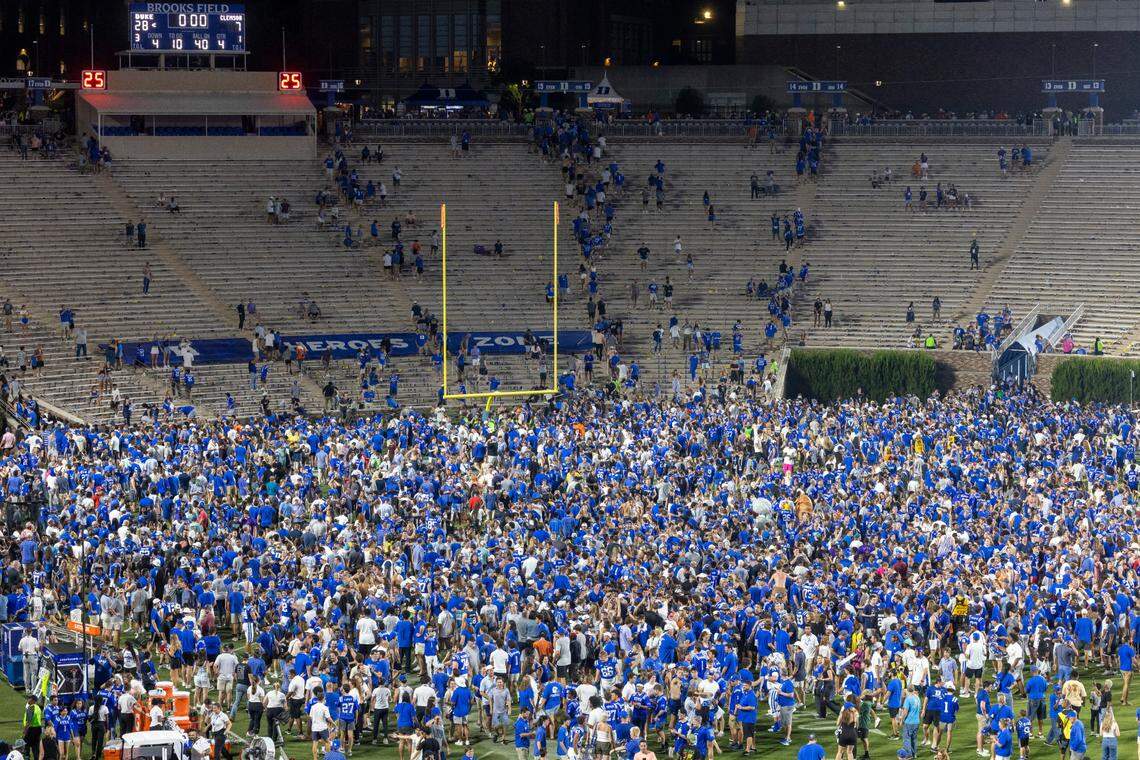 Duke fans storm the field to celebrate their 28-7 victory over Clemson on Monday, September 4, 2023 at Wallace Wade Stadium Stadium in Durham, N.C.